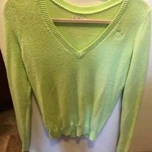 Lime green very long sleeves some pilling/fuzz. For a taller person